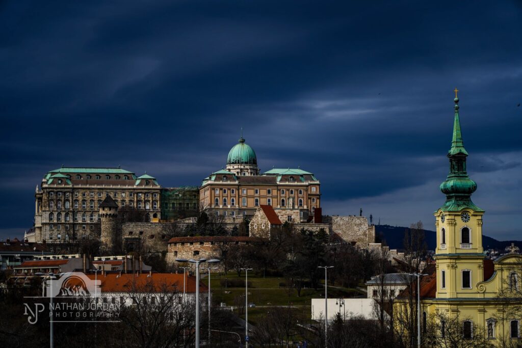 Fisherman's Bastion Budapest from a distance on a sunny day before a storm nathan jordan photography