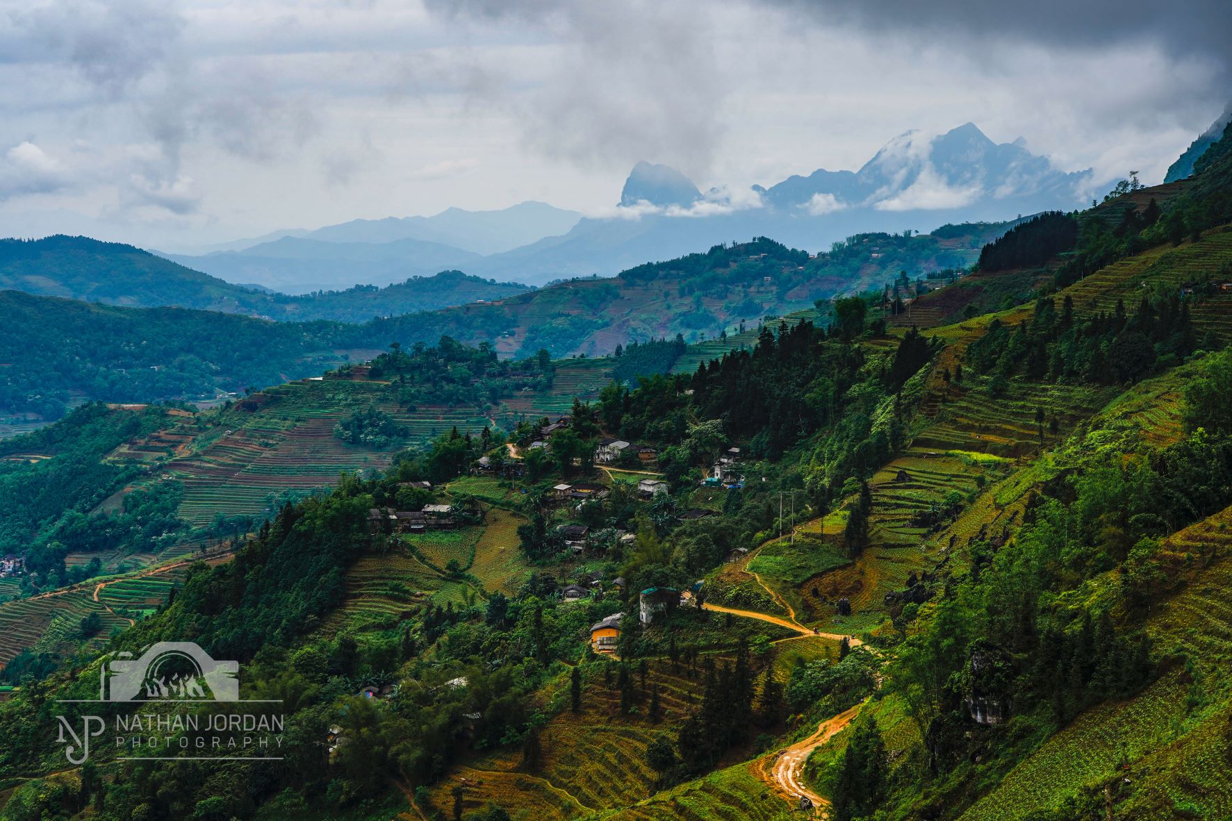 Mountains and jungle during misty weather at a Ha Giang Loop Wilderness Viewpoint nathan jordan photography