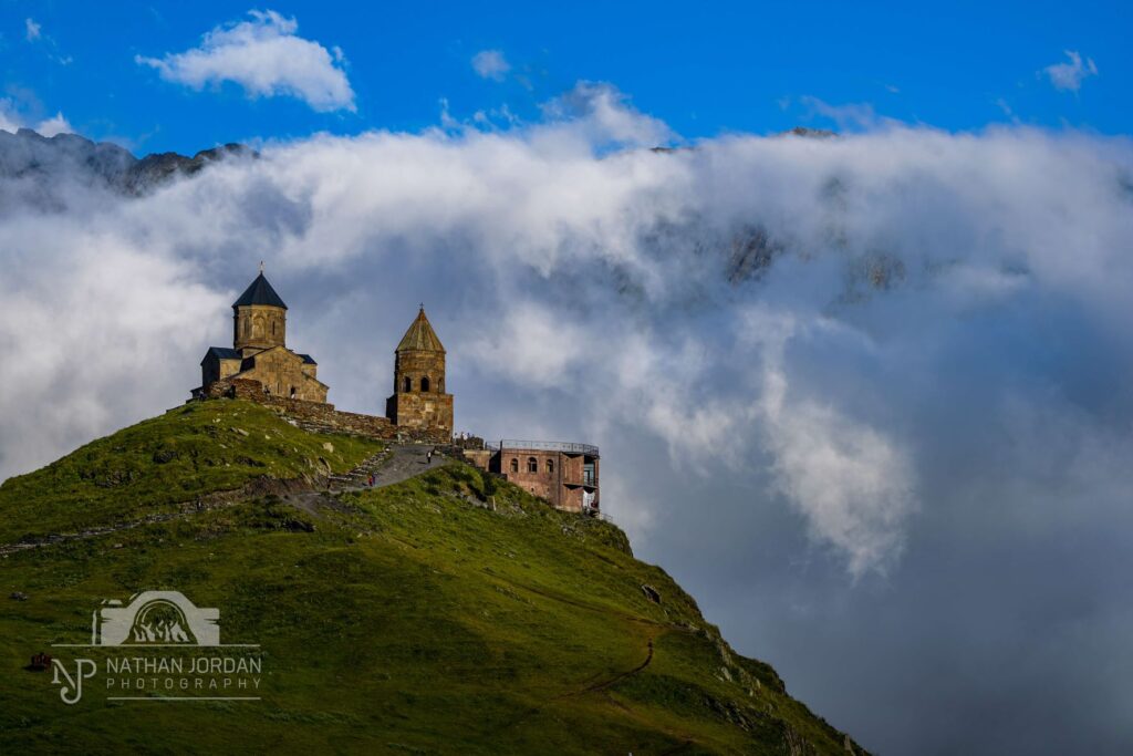 Saint Gergeti Church surrounded by clouds nathan jordan photography